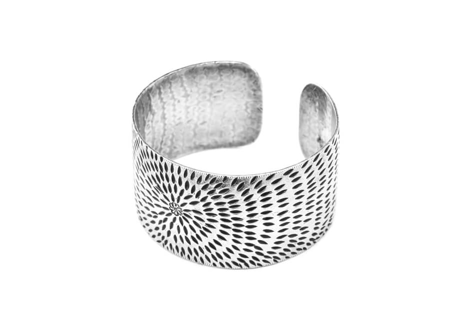 Sunburst silver cuff bangle from Hill to Street over a white background