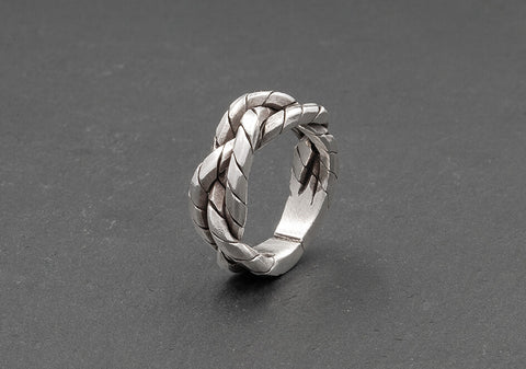 Thick braided silver ring with lines