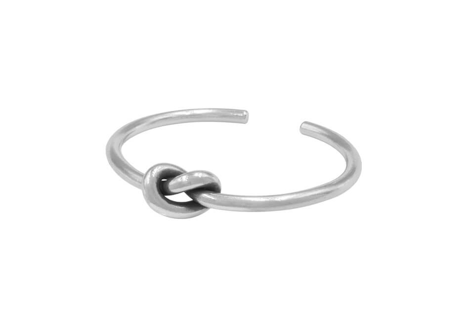 Big knotted silver bracelet from Hill to Street over a white background
