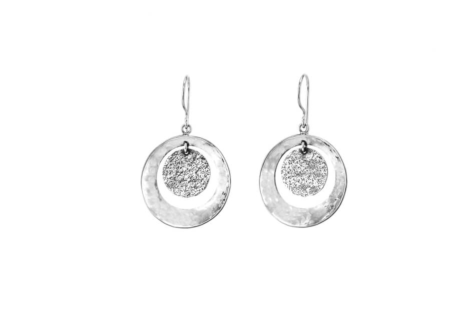 Pair of etched double-circle drop earrings over white background