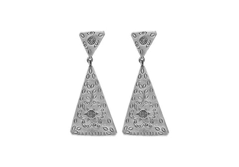 Pair of geometric stamped silver earrings from Hill to Street over a white background