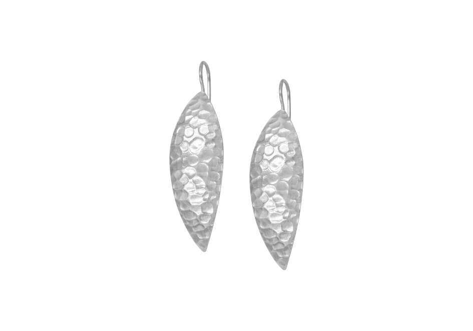 Pair of hammered silver drop earrings over a white background