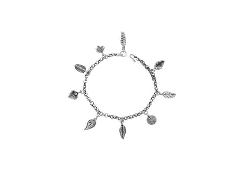 Multi-charm silver chain anklet from Hill to Street over a white background