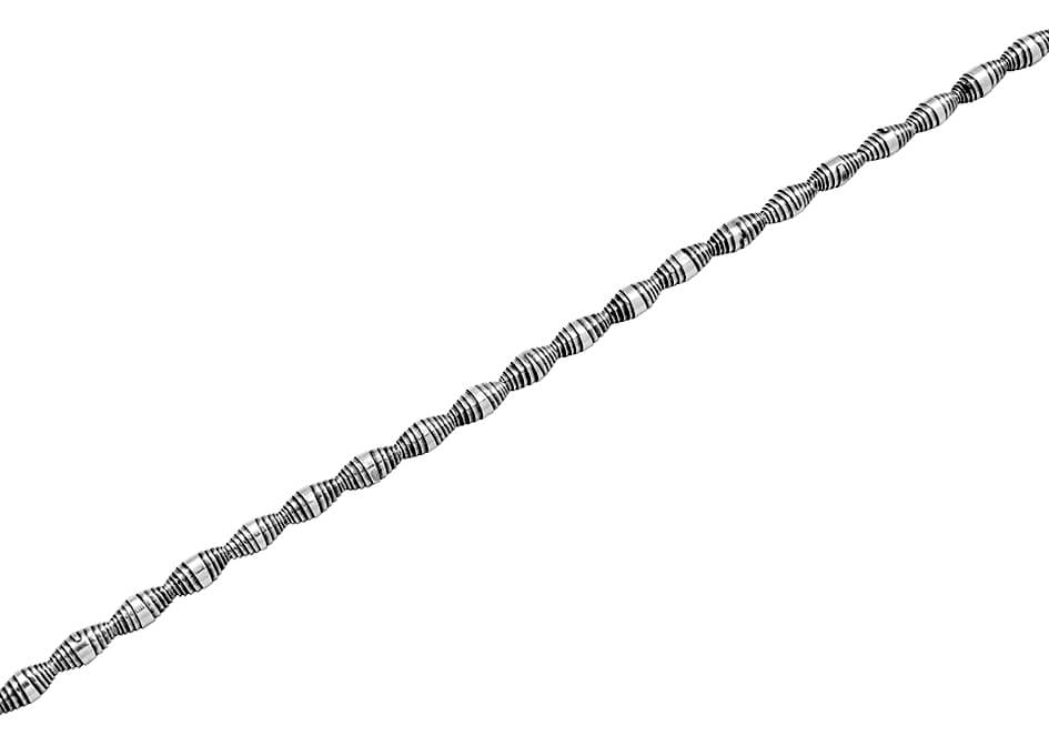 Rolled up silver beads anklet from Hill to Street over a white background