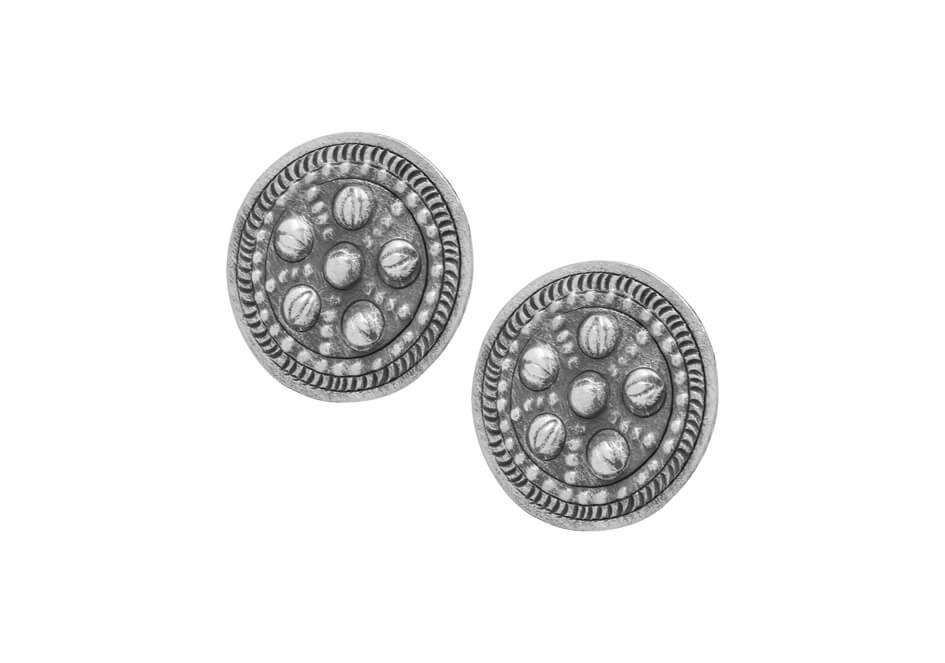 Pair of tribal silver stud earrings from Hill to Street over white background
