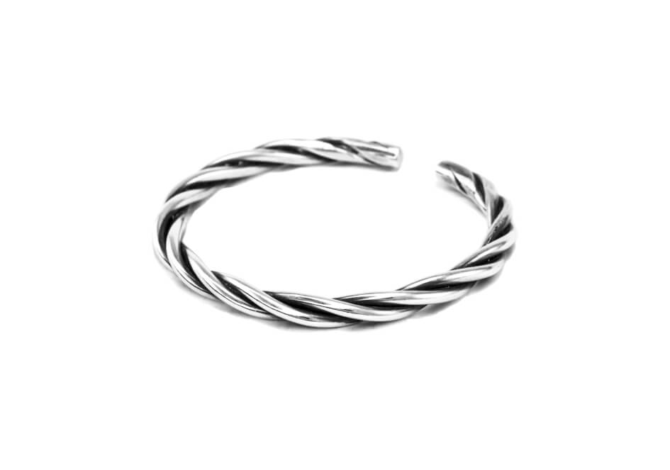Twisted silver wire cuff bangle from Hill to Street over a white background