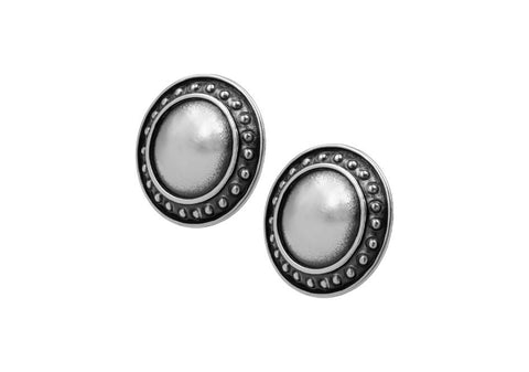 Pair of vintage silver tone round stud earrings from Hill to Street over a white background
