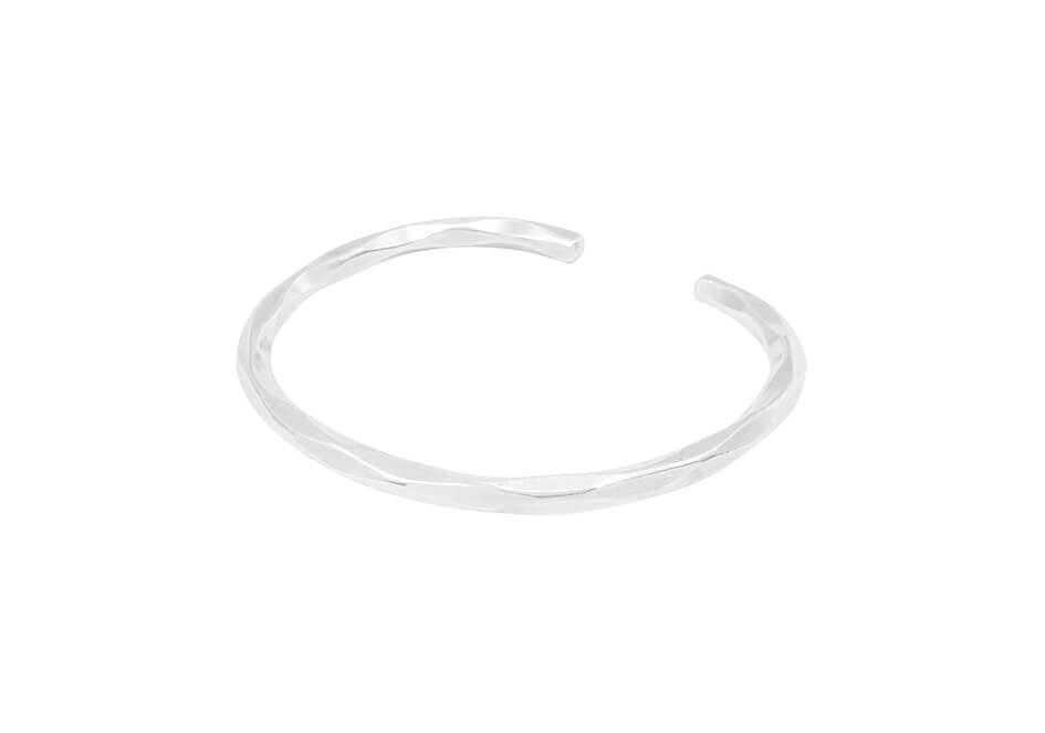Wave-cut open cuff bracelet from Hill to Street over a white background